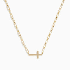 The 14K Yellow Gold West-East Cross Paperclip Chain Necklace 17 features a delicate paperclip chain and a small horizontal cross pendant, all crafted in 14K yellow gold.