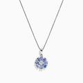 A 925 Sterling Silver pendant featuring a floral cluster of round and oval light blue tanzanite and sapphire gemstones, 1.52 TCW, set against a white background.