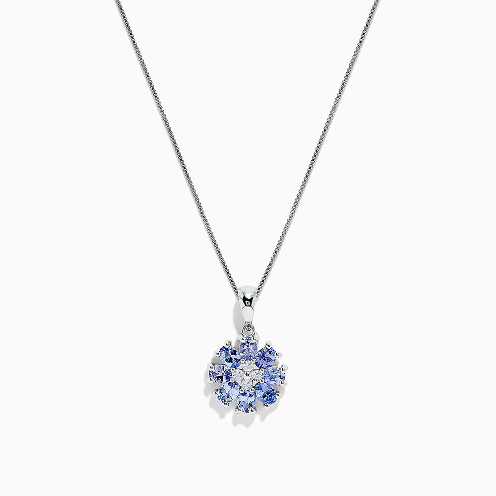 A 925 Sterling Silver pendant featuring a floral cluster of round and oval light blue tanzanite and sapphire gemstones, 1.52 TCW, set against a white background.