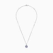 A 925 Sterling Silver pendant featuring a floral cluster of round and oval light blue tanzanite and sapphire gemstones, 1.52 TCW, set against a white background.