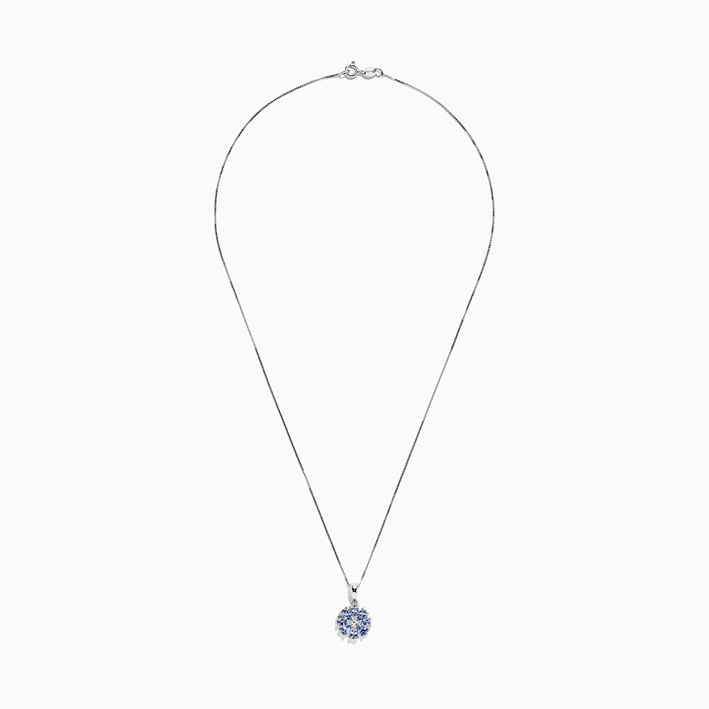 A 925 Sterling Silver pendant featuring a floral cluster of round and oval light blue tanzanite and sapphire gemstones, 1.52 TCW, set against a white background.