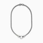 The Signature Sterling Silver & 18K Gold Diamond and Tsavorite Panther Necklace (0.48 TCW) showcases two sculpted panther heads with gripping rings adorned with diamonds and tsavorites, elegantly connecting both sides of the textured chain.