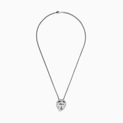 The 925 Sterling Silver Black Diamond Lion Pendant (0.07 TCW) showcases a lions head with detailed features and black diamond eyes, suspended from a twisted chain.