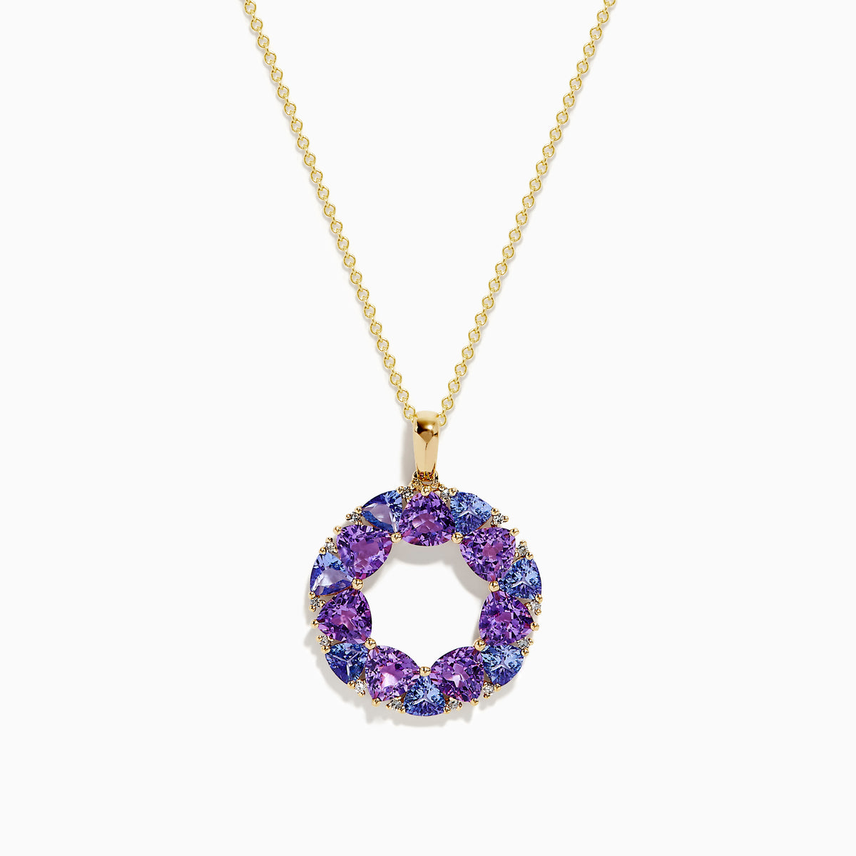 The 14K Yellow Gold Amethyst, Tanzanite, and Diamond Pendant features alternating colorful gemstones in a circular design, hanging elegantly from a delicate gold chain.