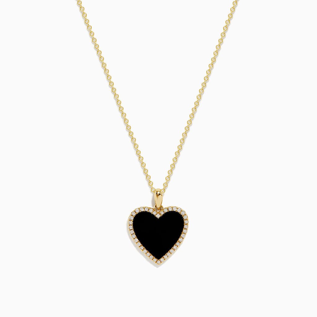 The 14K Yellow Gold Onyx and Diamond Heart Pendant features a heart-shaped onyx accented with sparkling diamonds, all set on a classic yellow gold chain for an elegant touch.