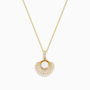 The 14K Yellow Gold Pearl and Diamond Shell Necklace features a pendant shaped like a fan with a central white pearl, surrounded by sparkling diamonds for timeless elegance.