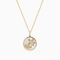 The 14K Yellow Gold Mother of Pearl and Diamond Turtle Pendant (0.13 TCW) features a circular turtle design accented with diamonds, shown against a white background.