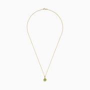 A 14K yellow gold peridot and diamond pendant (1.10 TCW) with a round peridot center, surrounded by sparkling diamonds, shown on a white background.
