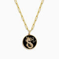 The Novelty 14K Yellow Gold Onyx and Diamond Dragon Coin Pendant (4.62 TCW) features an oval onyx with a gold dragon design, framed by a twisted rope border and accented on an elongated link chain with small gold beads.