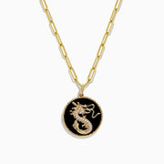 The Novelty 14K Yellow Gold Onyx and Diamond Dragon Coin Pendant (4.62 TCW) features an oval onyx with a gold dragon design, framed by a twisted rope border and accented on an elongated link chain with small gold beads.