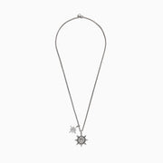 Mens Sterling Silver Ships Wheel and Star Pendant features two pendants—a star and a ship’s wheel with rope detailing and a central star design—hanging from a textured chain.