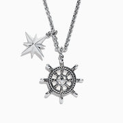 Mens Sterling Silver Ships Wheel and Star Pendant features two pendants—a star and a ship’s wheel with rope detailing and a central star design—hanging from a textured chain.