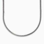 A close-up image of the Mens 925 Sterling Silver Chain in a classic Cuban link design, displayed against a white background with the necklace arranged in a partial U shape.