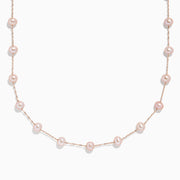 The 14K Rose Gold Cultured Fresh Water Pearl Necklace features delicate, evenly spaced pearls and is displayed against a plain white background.