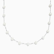 The 14K White Gold Cultured Fresh Water Pearl Necklace features evenly spaced small pearls on a delicate chain, shown against a plain white background.