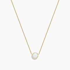 The Aurora 14K Yellow Gold Bezel Set Opal Necklace (0.55 TCW) features a round white opal pendant on a delicate gold chain—an elegant piece from the Effy Aurora collection.