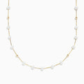 The 14K Yellow Gold Freshwater Pearl Necklace features small white pearls and gold beads arranged alternately along a delicate yellow gold chain, offering a simple yet elegant design in classic Effy style.