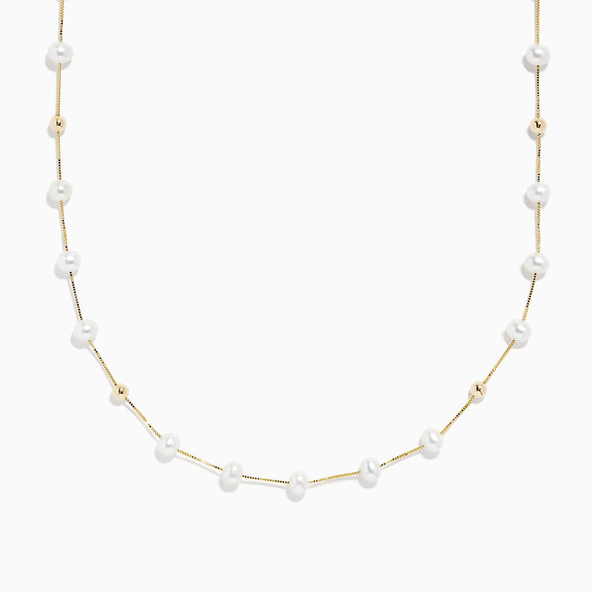 The 14K Yellow Gold Freshwater Pearl Necklace features small white pearls and gold beads arranged alternately along a delicate yellow gold chain, offering a simple yet elegant design in classic Effy style.