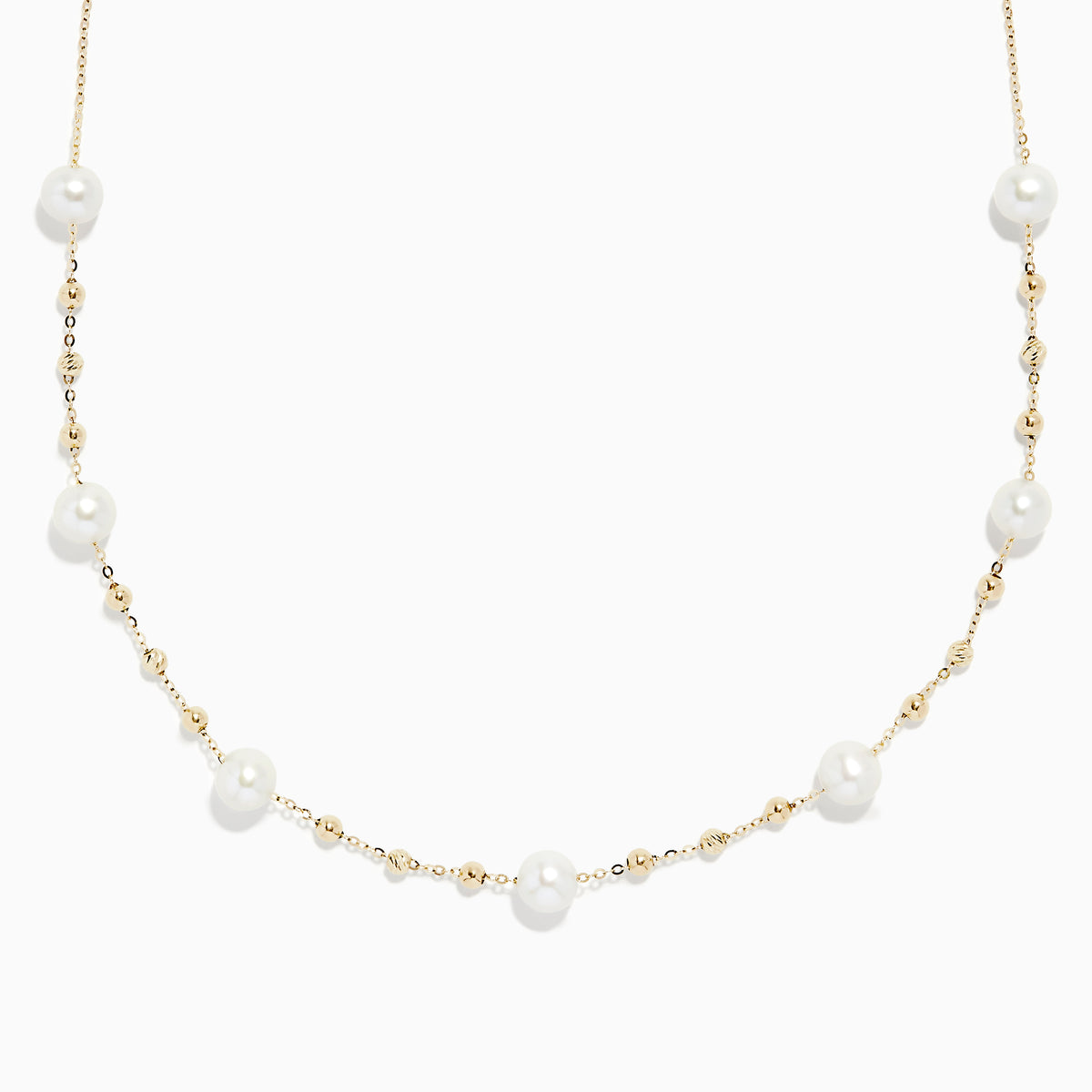 The 14K Yellow Gold 16 Pearl Station Necklace showcases evenly spaced white pearls and gold beads along a delicate chain.