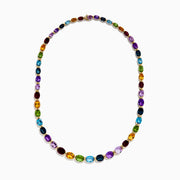 The Mosaic 14K Yellow Gold Multi Gemstone Necklace showcases oval-shaped, multicolored gemstones evenly spaced along a gold chain, shown against a white background.