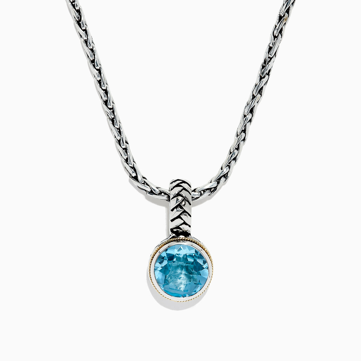 A 925 sterling silver necklace with an 18K gold-accented, round blue topaz pendant (7.36 TCW) is displayed on a white background.