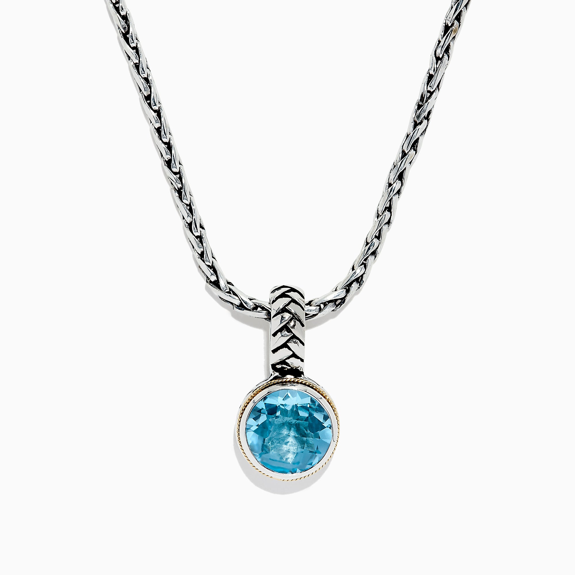 A 925 sterling silver necklace with an 18K gold-accented, round blue topaz pendant (7.36 TCW) is displayed on a white background.