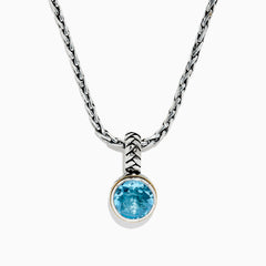 A 925 sterling silver necklace with an 18K gold-accented, round blue topaz pendant (7.36 TCW) is displayed on a white background.