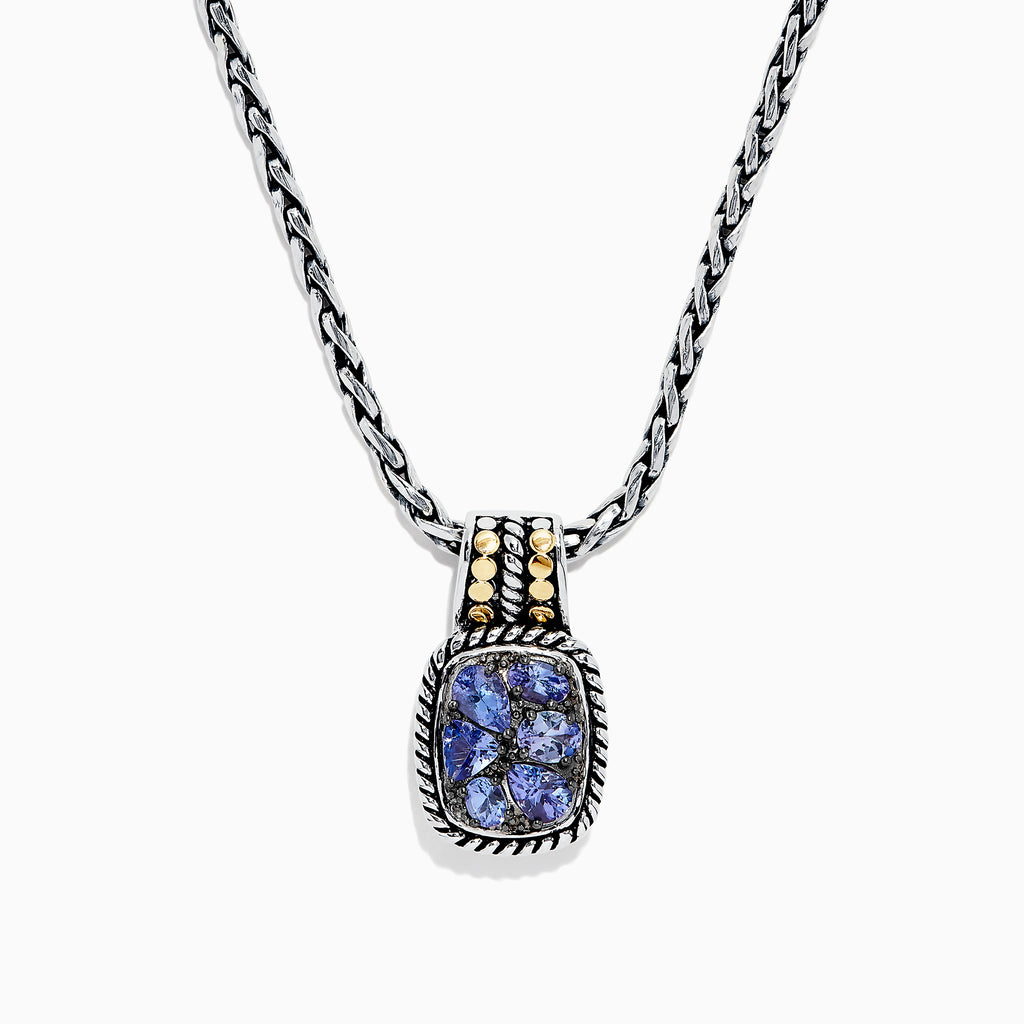 The Nahla Siri Silver & 18K Gold Tanzanite Pendant, 1.85 TCW, features a silver chain and a rectangular pendant with four blue tanzanites set in a decorative frame, accented by 18K gold at the top.