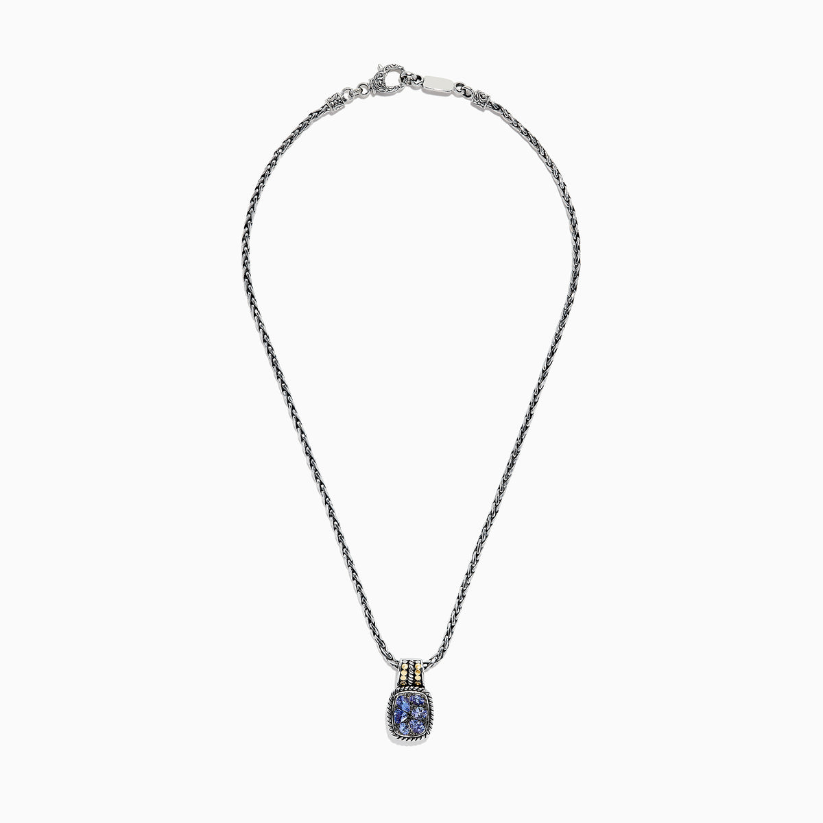 The Nahla Siri Silver & 18K Gold Tanzanite Pendant, 1.85 TCW, features a silver chain and a rectangular pendant with four blue tanzanites set in a decorative frame, accented by 18K gold at the top.