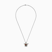 The Seaside Sterling Silver Multi Gemstone Turtle Pendant (2.00 TCW) features a heart-shaped shell on a silver chain, showcased against a white background.