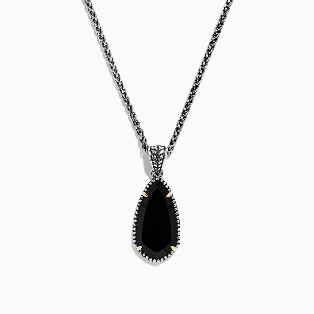 The Eclipse 925 Sterling Silver Onyx Pendant (4.56 TCW) showcases a large, teardrop-shaped onyx in a decorative bezel setting on a sterling silver chain, set against a white background.