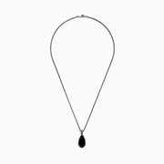 The Eclipse 925 Sterling Silver Onyx Pendant (4.56 TCW) showcases a large, teardrop-shaped onyx in a decorative bezel setting on a sterling silver chain, set against a white background.