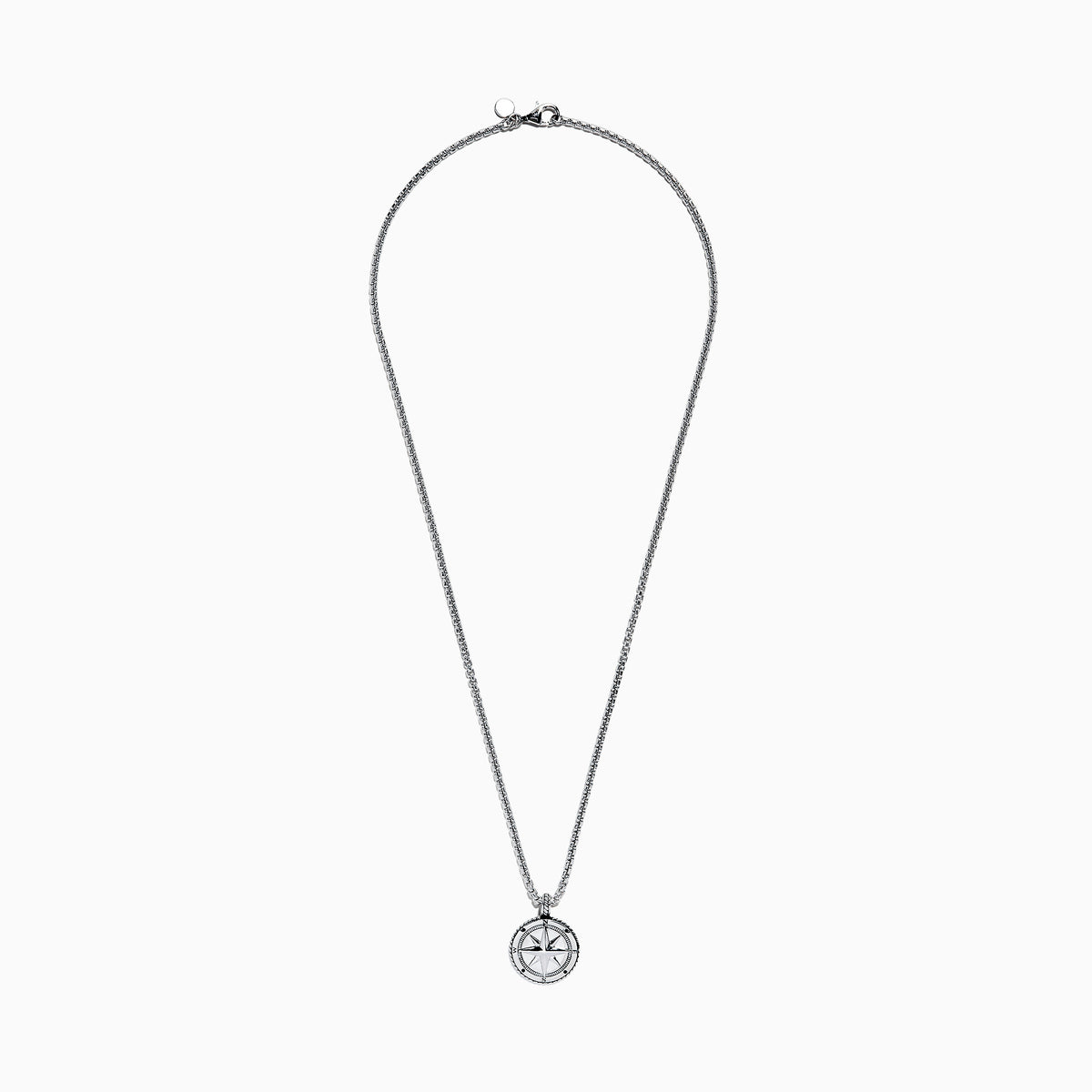 The Mens Sterling Silver Compass Pendant features a silver chain, a round pendant with a raised star, and engraved cardinal directions (N, E, S, W)—a bold accessory for any style.