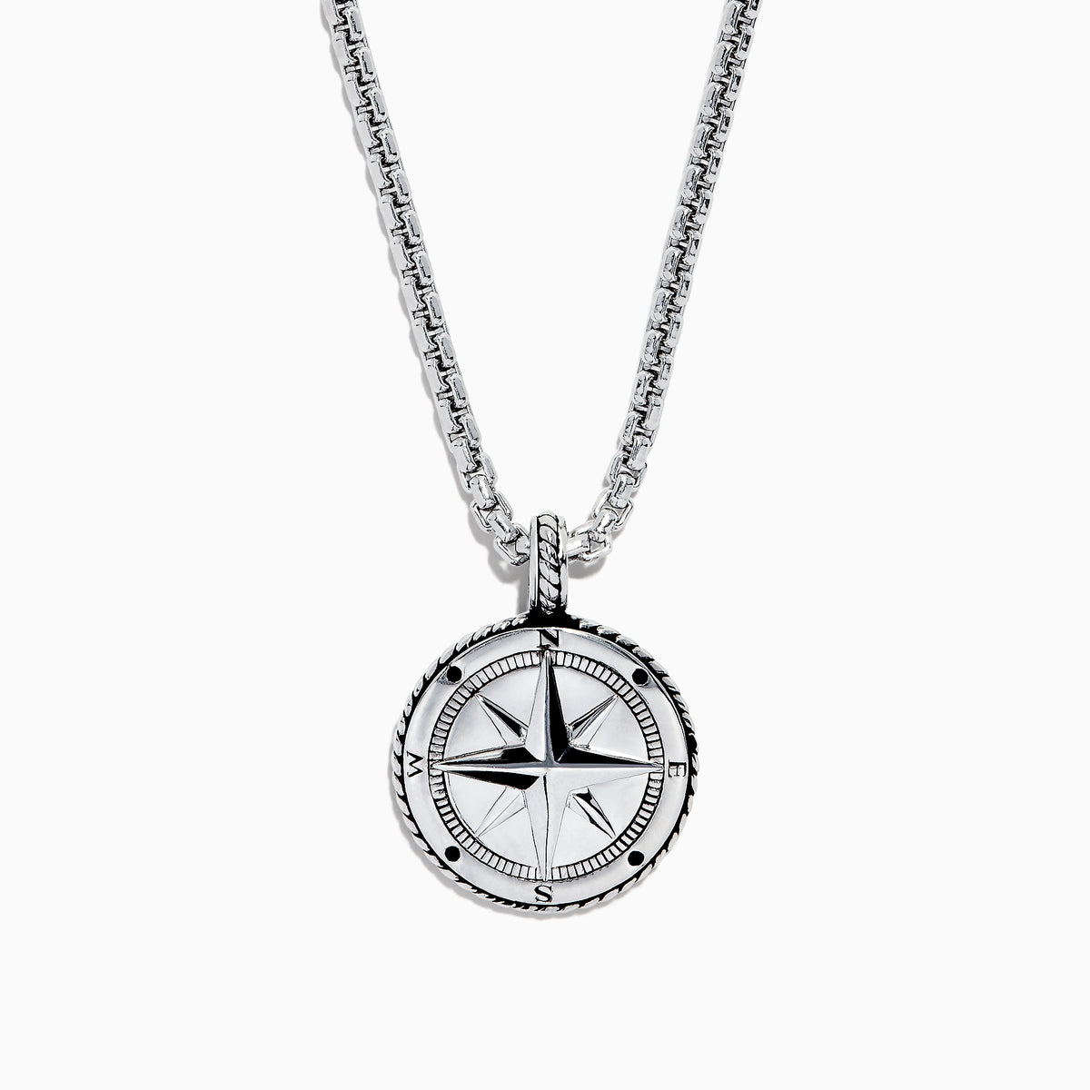 The Mens Sterling Silver Compass Pendant features a silver chain, a round pendant with a raised star, and engraved cardinal directions (N, E, S, W)—a bold accessory for any style.