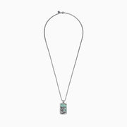 The Men’s Sterling Silver Turquoise Wave Pendant, 10.50 TCW, features a rectangular design with an engraved ocean wave and a vibrant turquoise stone background.