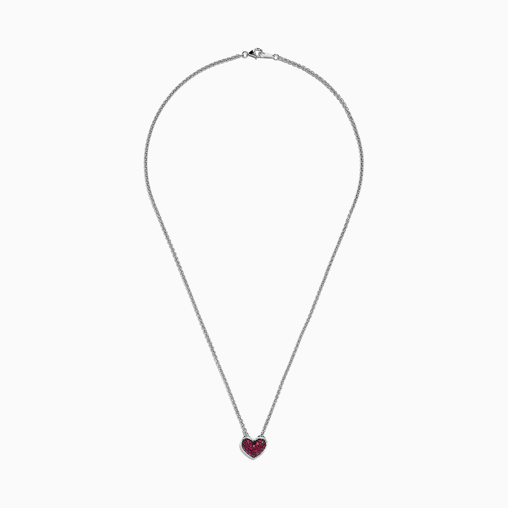 The 925 Sterling Silver Ruby Heart Pendant, 0.65 TCW, is featured on a simple white background, showcasing its ruby heart design with sparkling red gemstones.