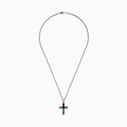 The Mosaic 925 Sterling Silver Multi Stone Cross Pendant features a sterling silver chain with a cross pendant adorned with rectangular orange, purple, green, and blue gemstones in a sleek silver frame.