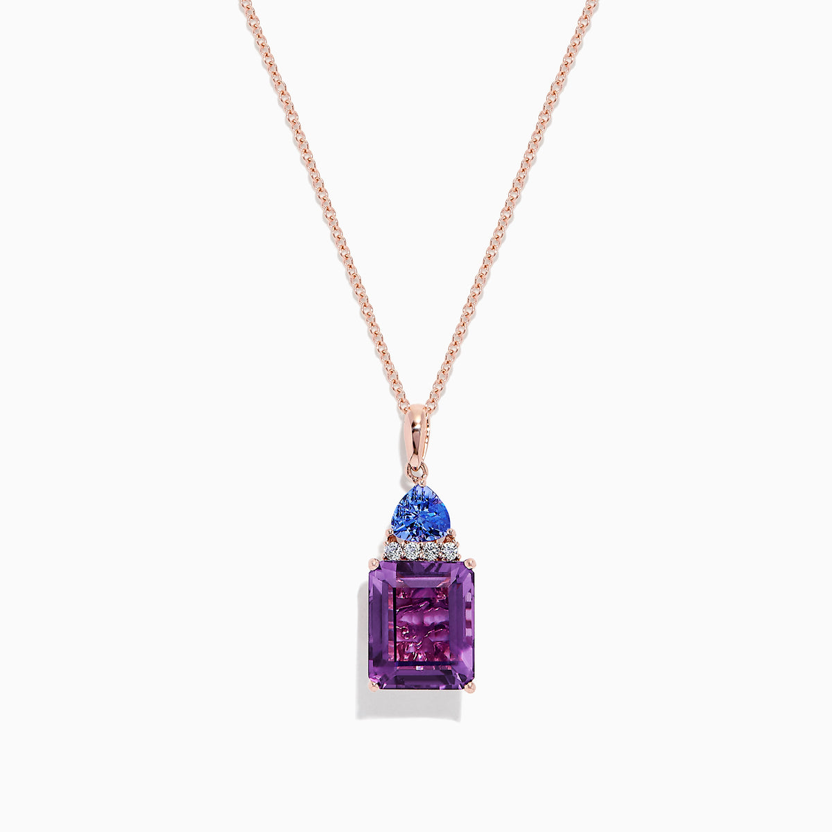 A 14K rose gold pendant features a rectangular amethyst, topped with tanzanite and diamond accents (6.16 TCW), set in gold against a white background.