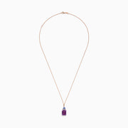 A 14K rose gold pendant features a rectangular amethyst, topped with tanzanite and diamond accents (6.16 TCW), set in gold against a white background.