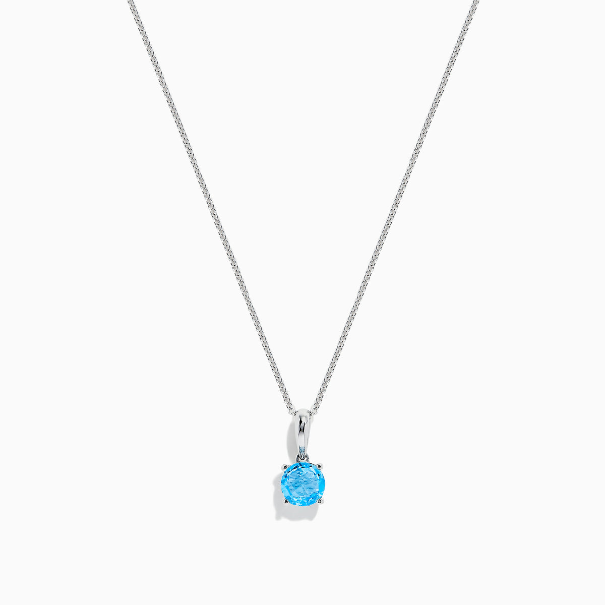 The Ocean Bleu 14K White Gold Blue Topaz Pendant, 1.00 TCW, features a single round blue topaz on a delicate white gold chain, showcased against a plain white background.