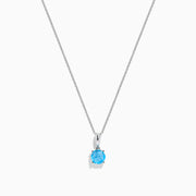 The Ocean Bleu 14K White Gold Blue Topaz Pendant, 1.00 TCW, features a single round blue topaz on a delicate white gold chain, showcased against a plain white background.