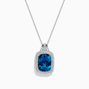 The Ocean Bleu 14K Gold London Blue Topaz and Diamond Pendant, 12.45 TCW, features a cushion-cut topaz surrounded by sparkling diamonds, shown against a white background.