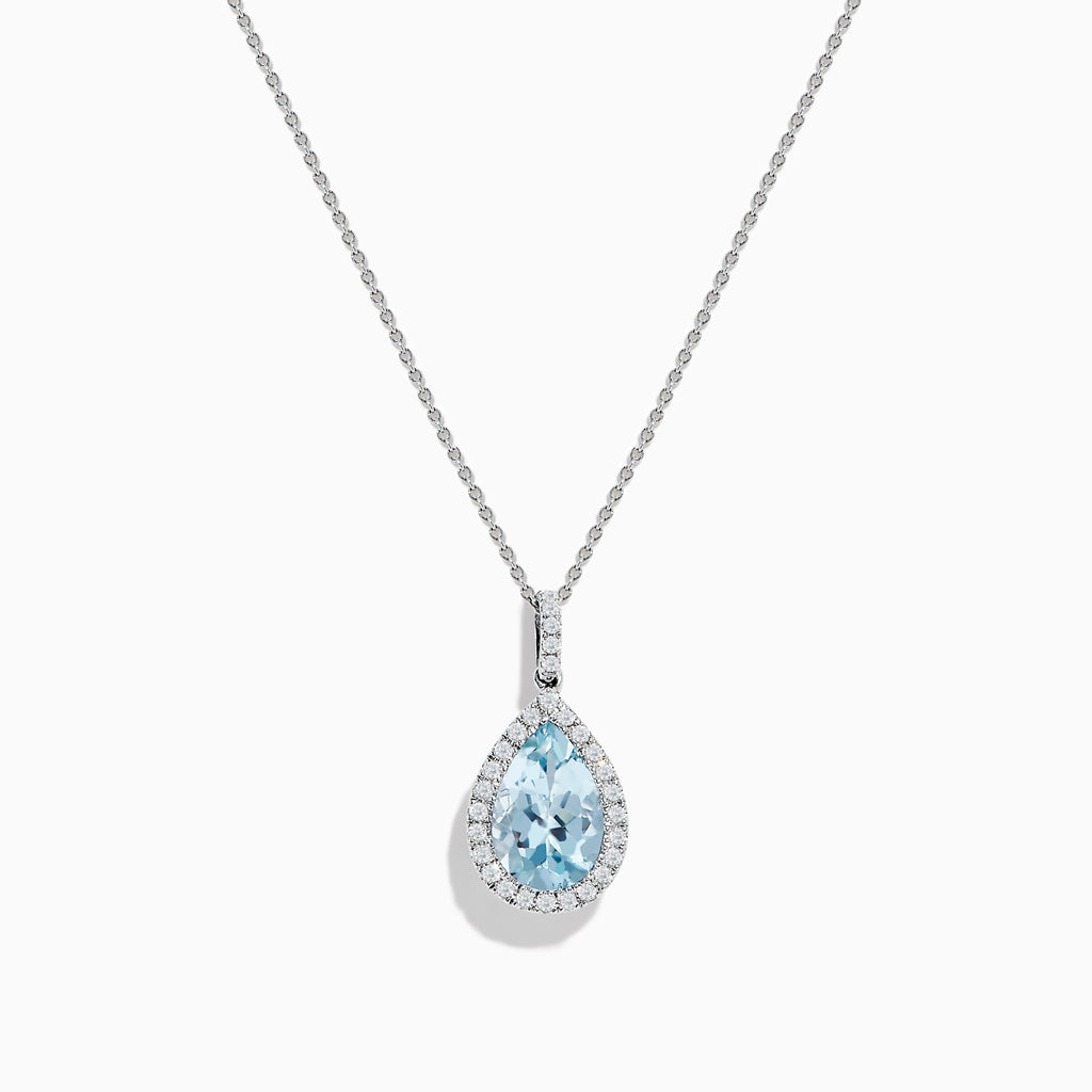 The Aquarius 14K White Gold Aquamarine and Diamond Pendant showcases a teardrop aquamarine framed by sparkling diamonds, elegantly displayed on a plain white background.