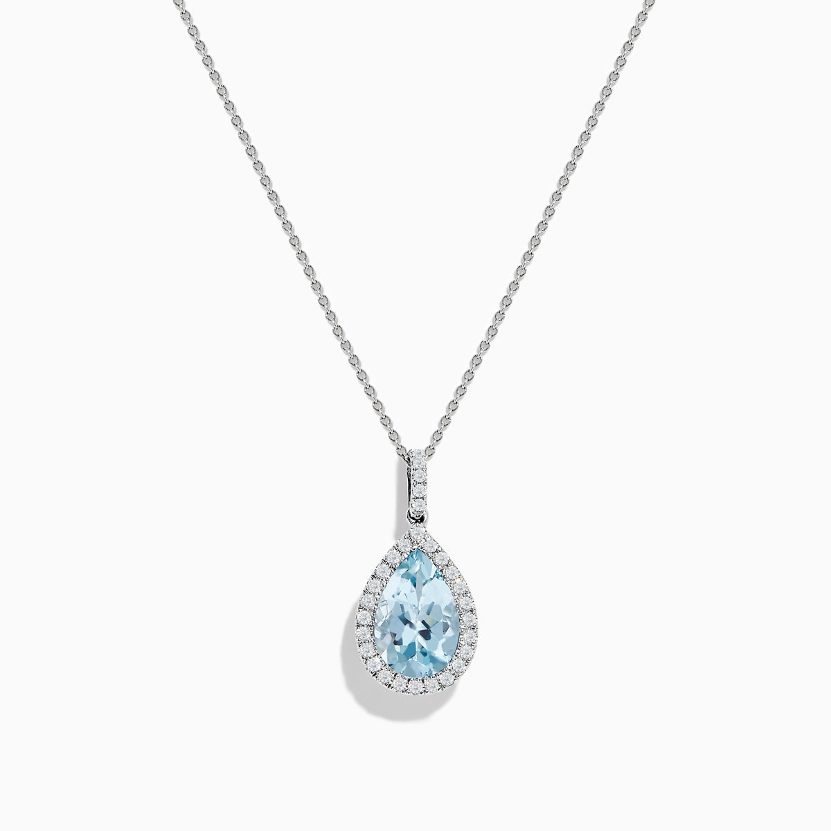 The Aquarius 14K White Gold Aquamarine and Diamond Pendant showcases a teardrop aquamarine framed by sparkling diamonds, elegantly displayed on a plain white background.