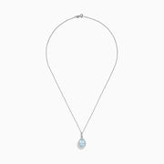 The Aquarius 14K White Gold Aquamarine and Diamond Pendant showcases a teardrop aquamarine framed by sparkling diamonds, elegantly displayed on a plain white background.