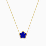 The Novelty 14K Yellow Gold Lapis Flower Necklace features a blue four-leaf clover-shaped pendant with a textured gold border, inspired by Effys signature design.