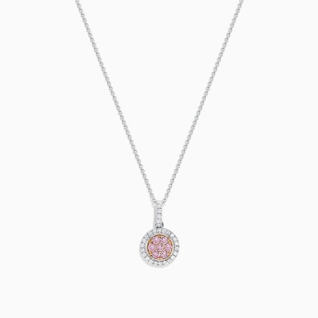 The 18K Two Tone Gold Pink and White Diamond Pendant features a circular design with a 0.42 TCW center cluster of pink diamonds, encircled by white diamonds, on a delicate chain for an elegant look.