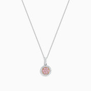 The 18K Two Tone Gold Pink and White Diamond Pendant features a circular design with a 0.42 TCW center cluster of pink diamonds, encircled by white diamonds, on a delicate chain for an elegant look.