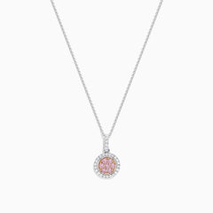 The 18K Two Tone Gold Pink and White Diamond Pendant features a circular design with a 0.42 TCW center cluster of pink diamonds, encircled by white diamonds, on a delicate chain for an elegant look.