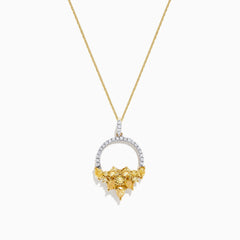 The 14K Yellow Gold Yellow and White Diamond Pendant (1.75 TCW) features a thin chain and a diamond-studded circular pendant with textured gold leaves forming a floral cluster for an elegant, intricate look.